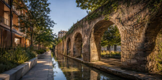 Χαλάνδρι: Η ευρωπαϊκή διαδρομή του Hydro-Heritage Cities και η επόμενη μέρα Αστικό κανάλι νερού δίπλα σε ιστορικές πέτρινες καμάρες και πράσινο