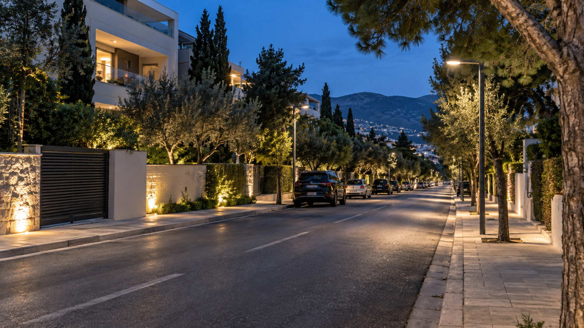 Σύγχρονος φωτισμός LED σε δενδροφυτεμένο αστικό δρόμο το σούρουπο